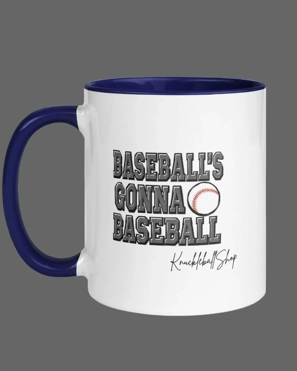 White coffee mug with blue handle and blue inside, Baseball's Gonna Baseball saying and signature