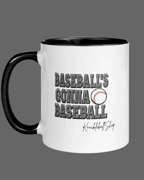 White coffee mug with black handle and black inside, Baseball's Gonna Baseball saying and signature