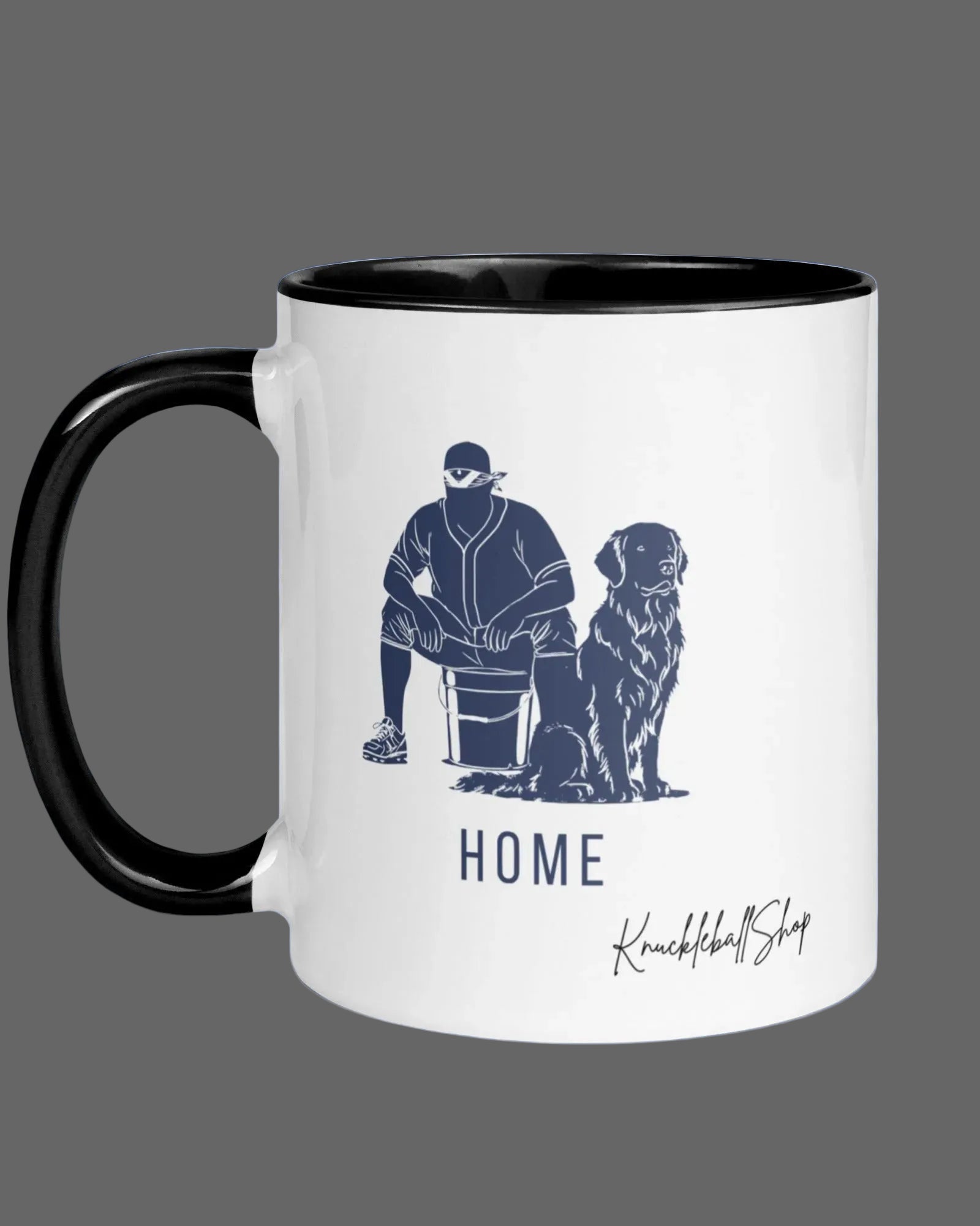 White coffee mug with black handle and black inside, "Home" featuring outline of player and his buddy, the team dog and signature