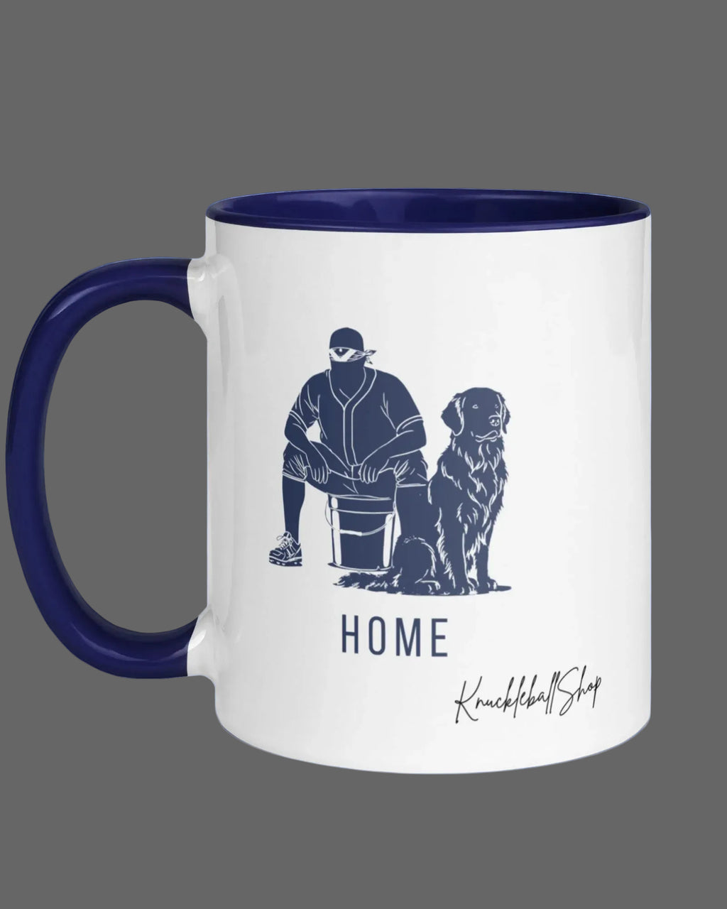 White coffee mug with blue handle and blue inside, "Home" featuring outline of player and his buddy, the team dog and signature