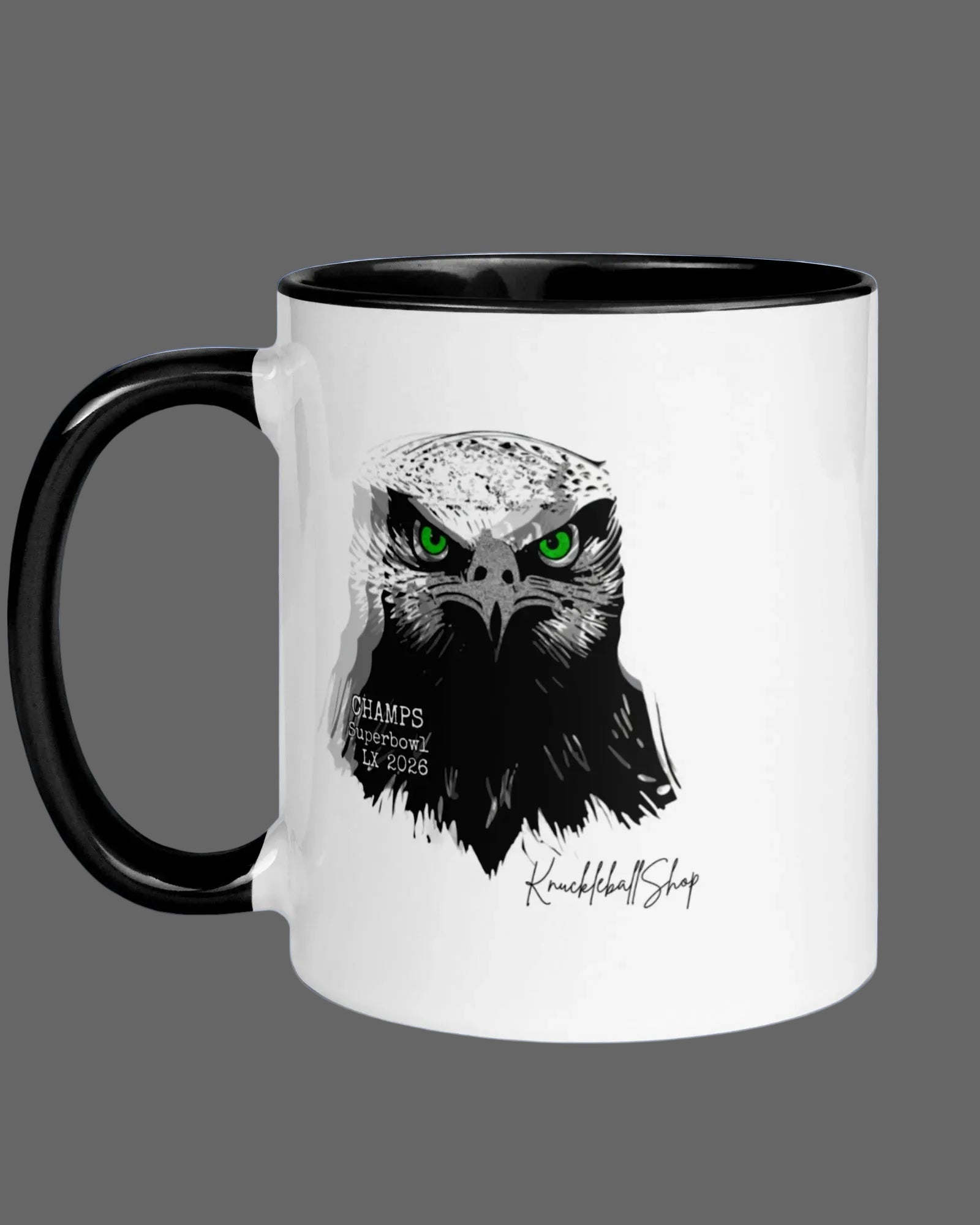 White coffee mug with black handle and black inside, Hawks Super Bowl LX Champs, 2026, Seahawk design with piercing green eyes.