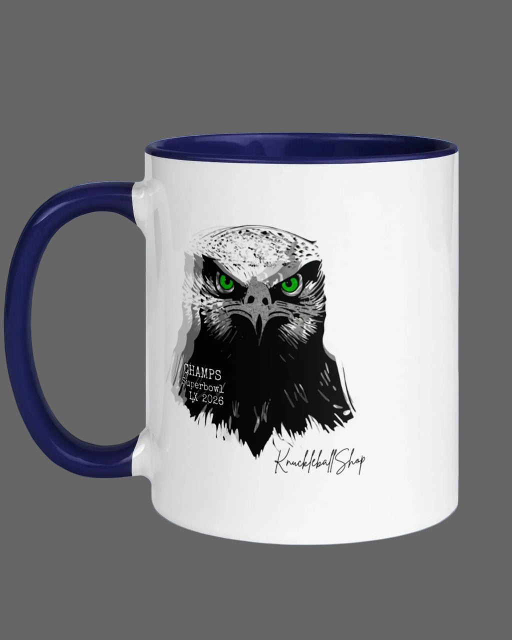 White coffee mug with blue handle and blue inside, Hawks Super Bowl LX Champs, 2026, Seahawk design with piercing green eyes.