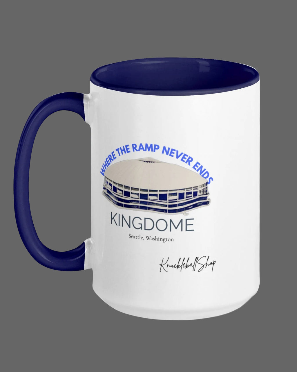 White mug with blue inside and blue handle featuring  the Kingdome with signature